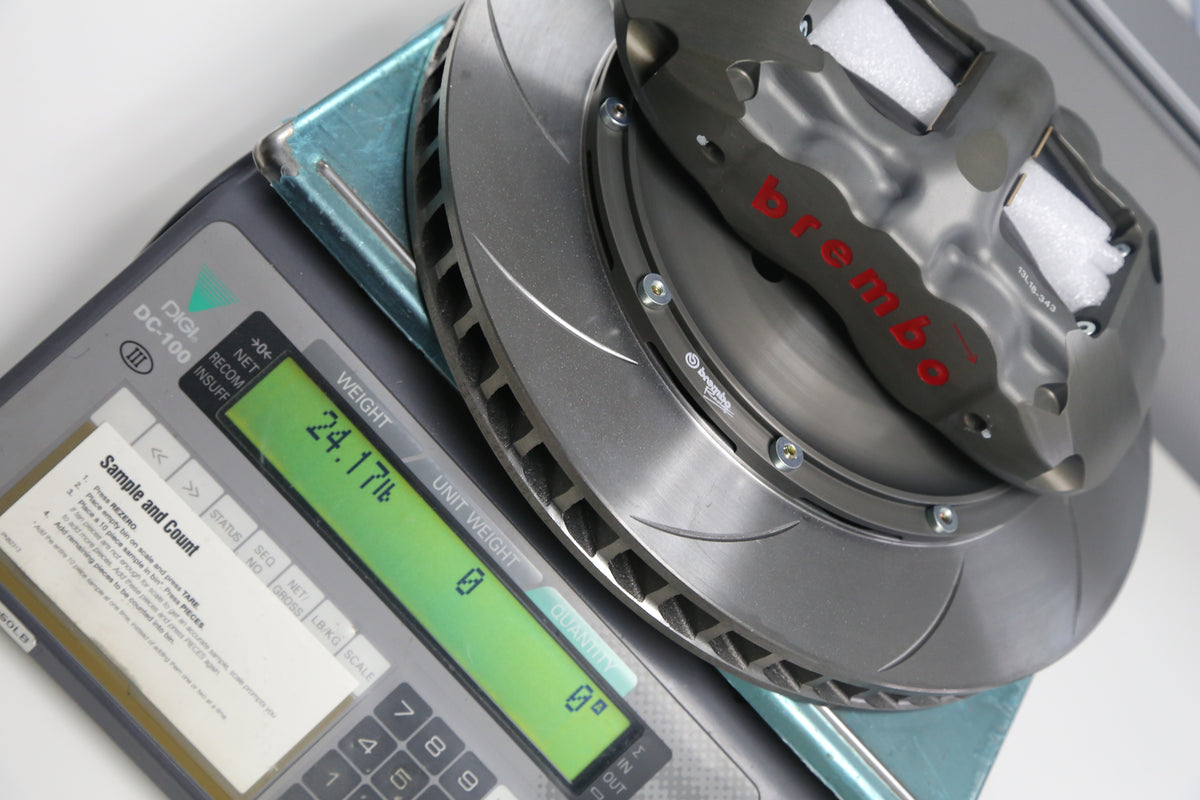 How much does a Brembo Performance big brake system weigh vs. O.E. components